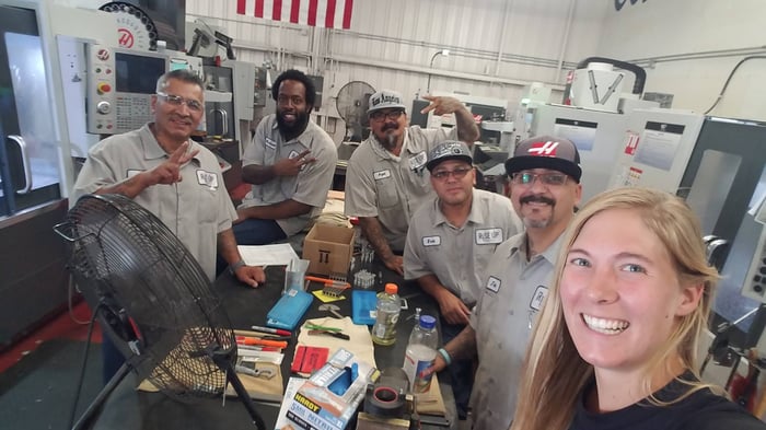 Leslie with the members of Rise Up Industries at the machine shop in Santee, CA.