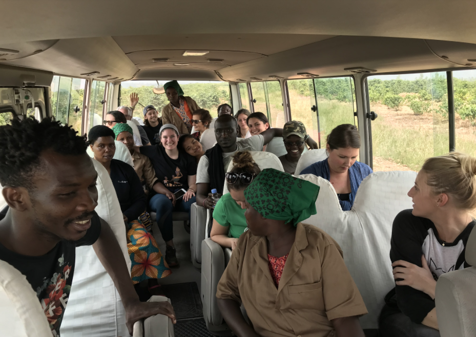 Bernadette relaxing with new friends on the ride back from the coffee fields.