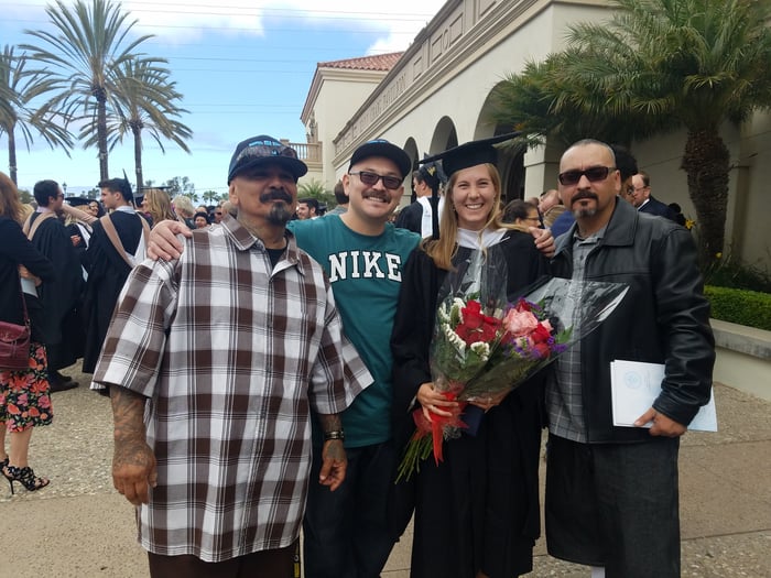 Leslie with three Rise Up Industries members at her Kroc School graduation in May 2018.