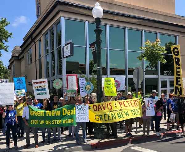 Green New Deal protest outside of rep. susan davis's office