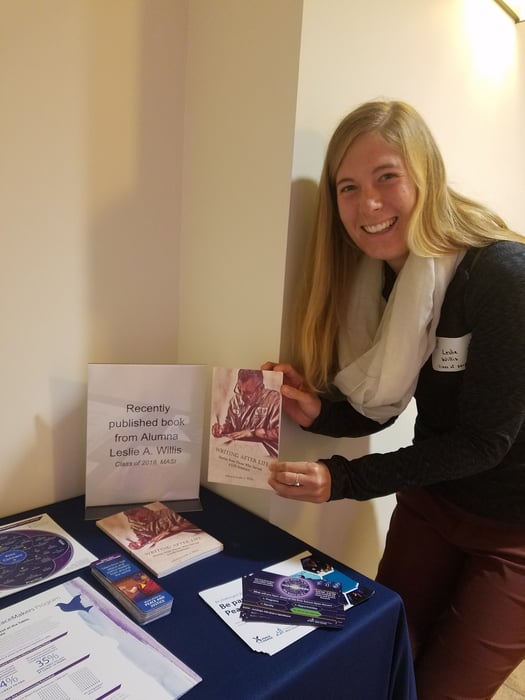 Leslie with her book at the Kroc School Homecoming Brunch, 2018.