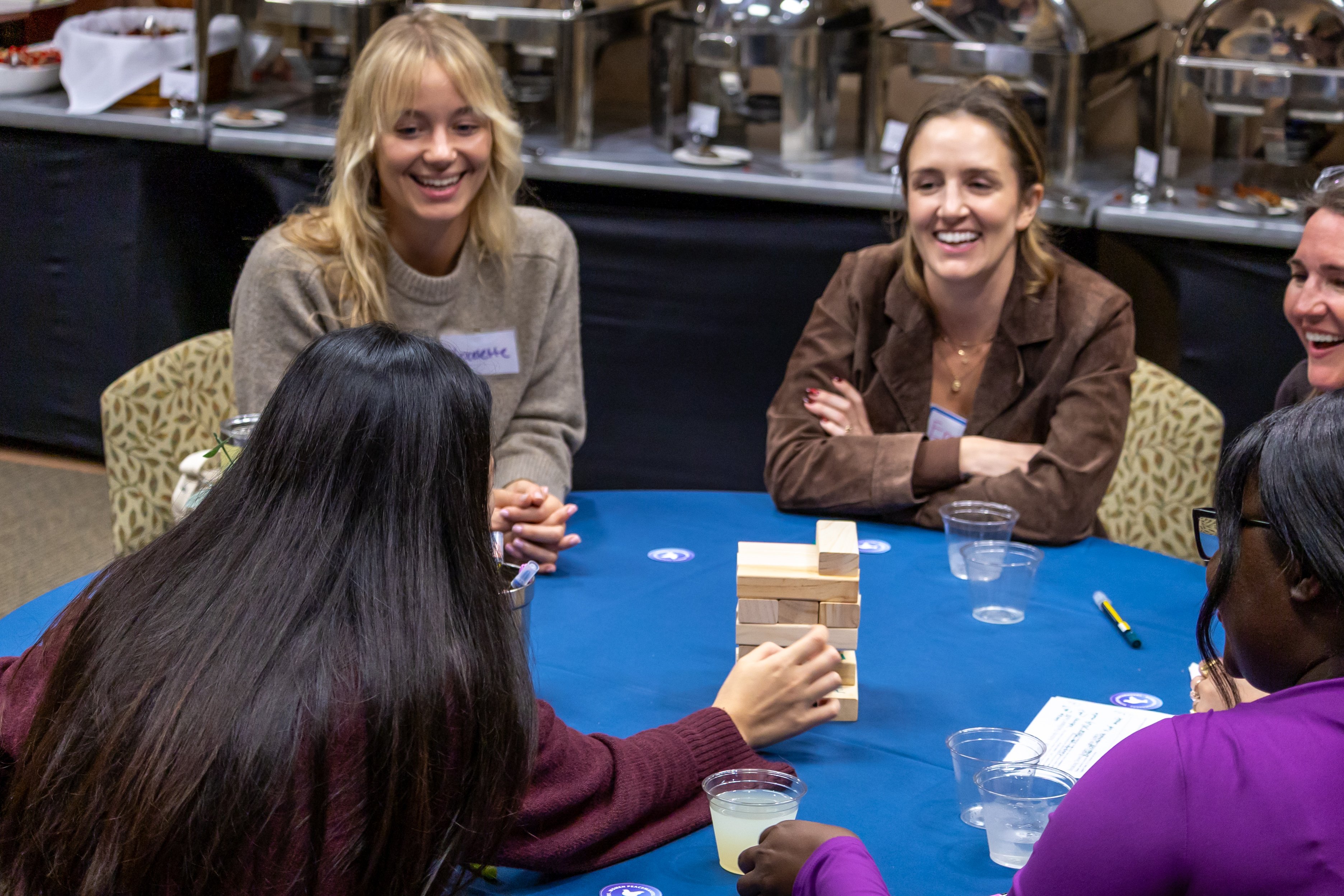 Kroc School students playing Jenga