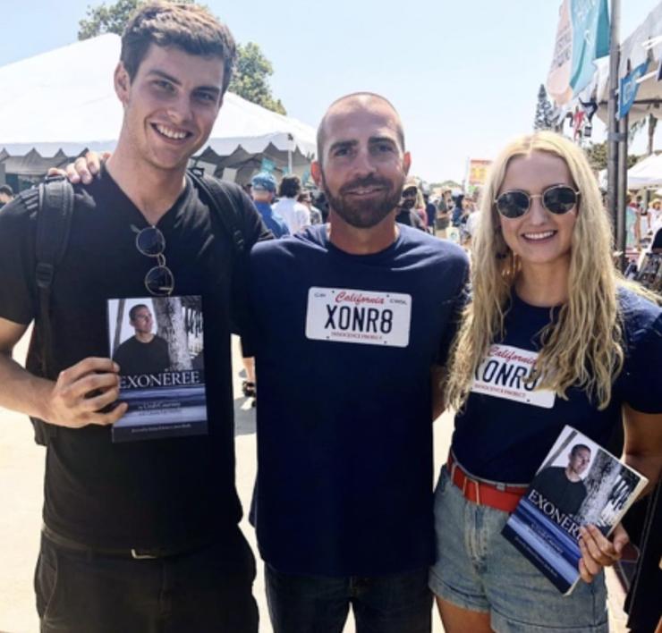 Matti Hurst (right) with exoneree and published author Uriah Courtney (center) at his book signing.